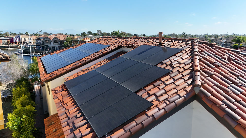 a close-up of solar panels installed on an orange county roof