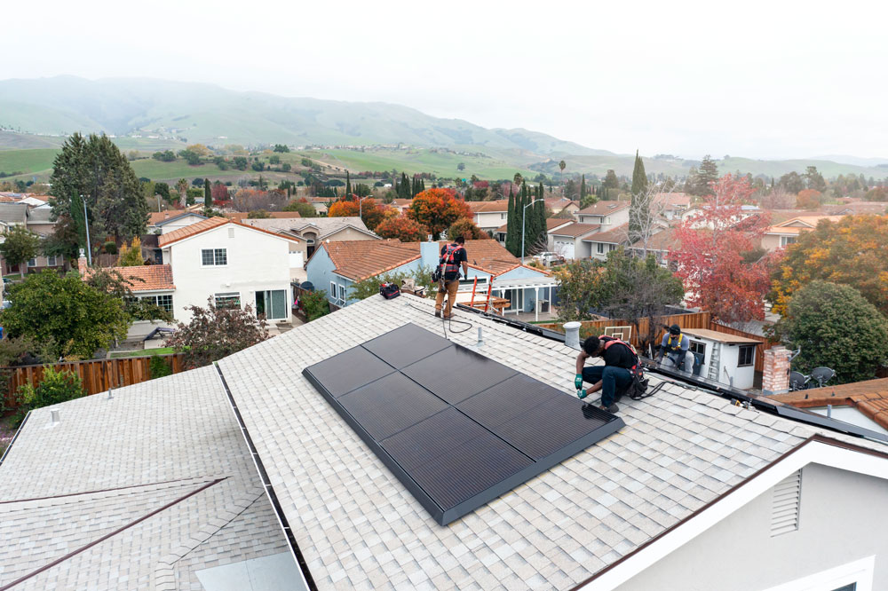 installing tesla solar panels on a roof