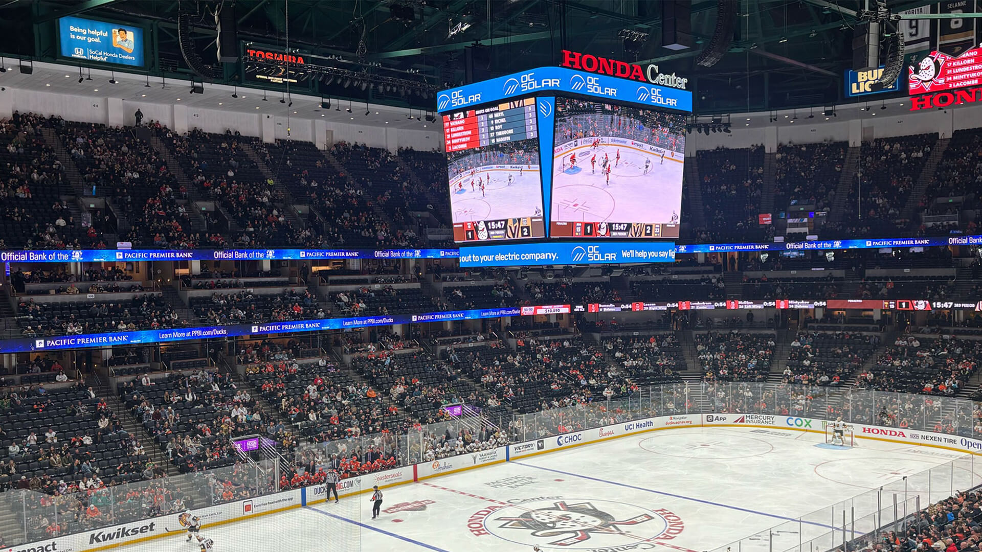 inside of the honda center during an anaheim ducks game showcasing the oc solar sponsorship
